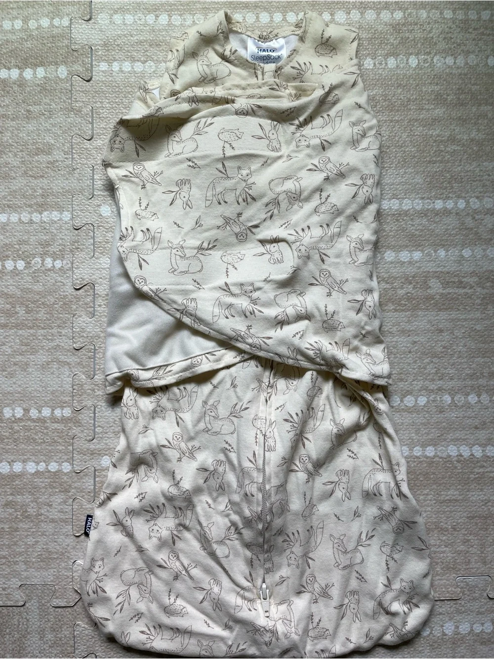 Halo SleepSack Swaddle in Cream with Brown Animal Print